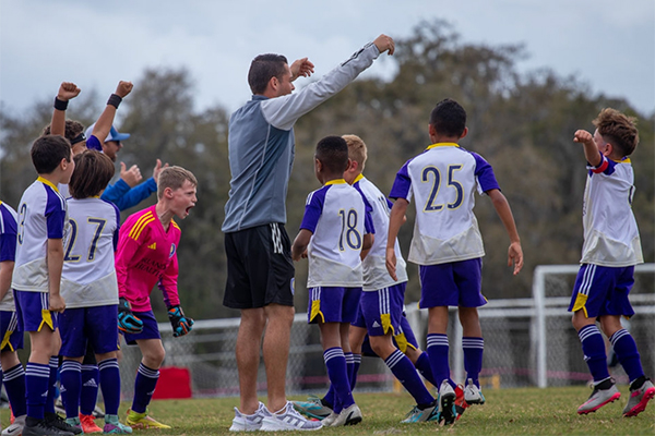 Keegan Celebrating a Victory with his boys team