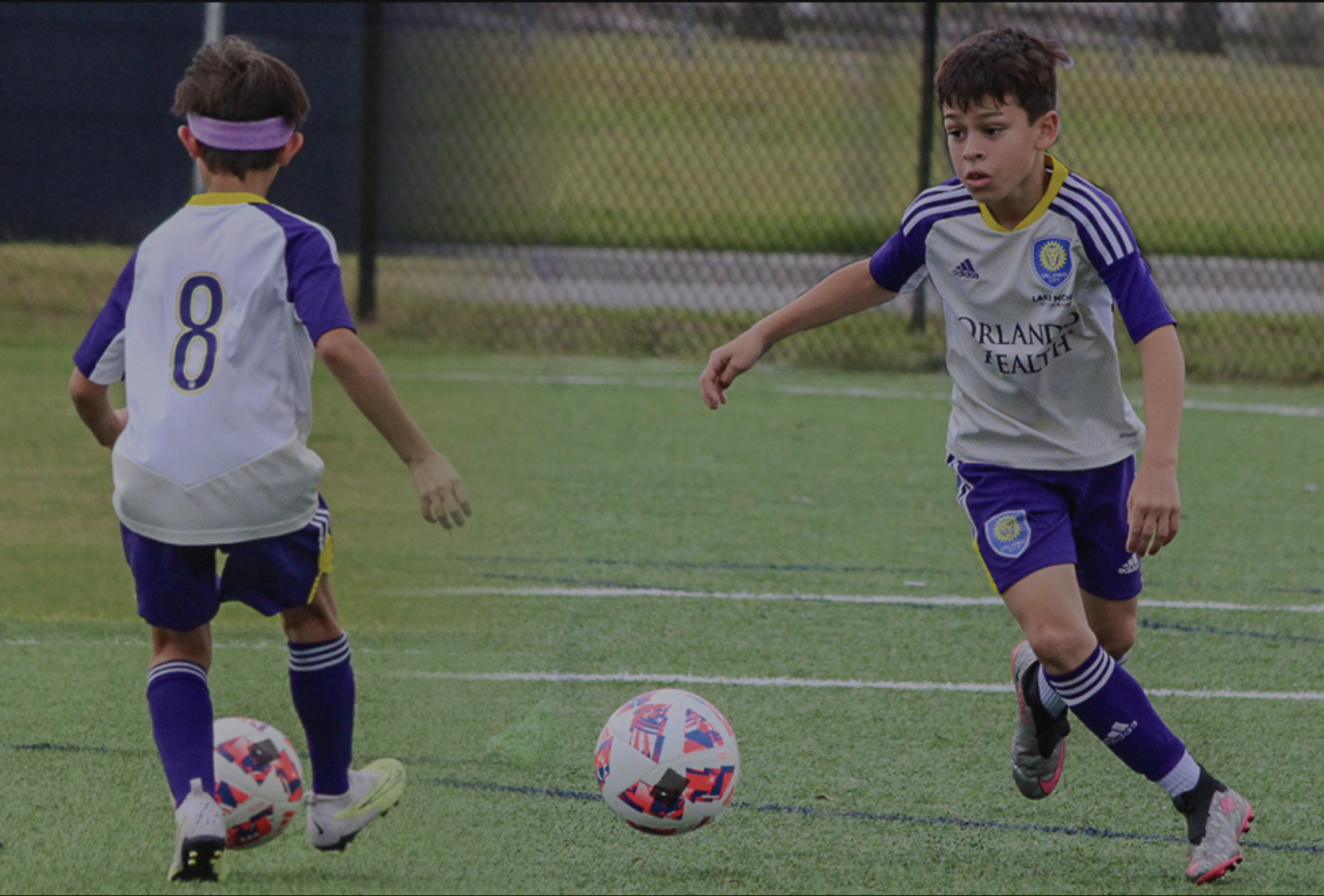 Kids playing competitive soccer
